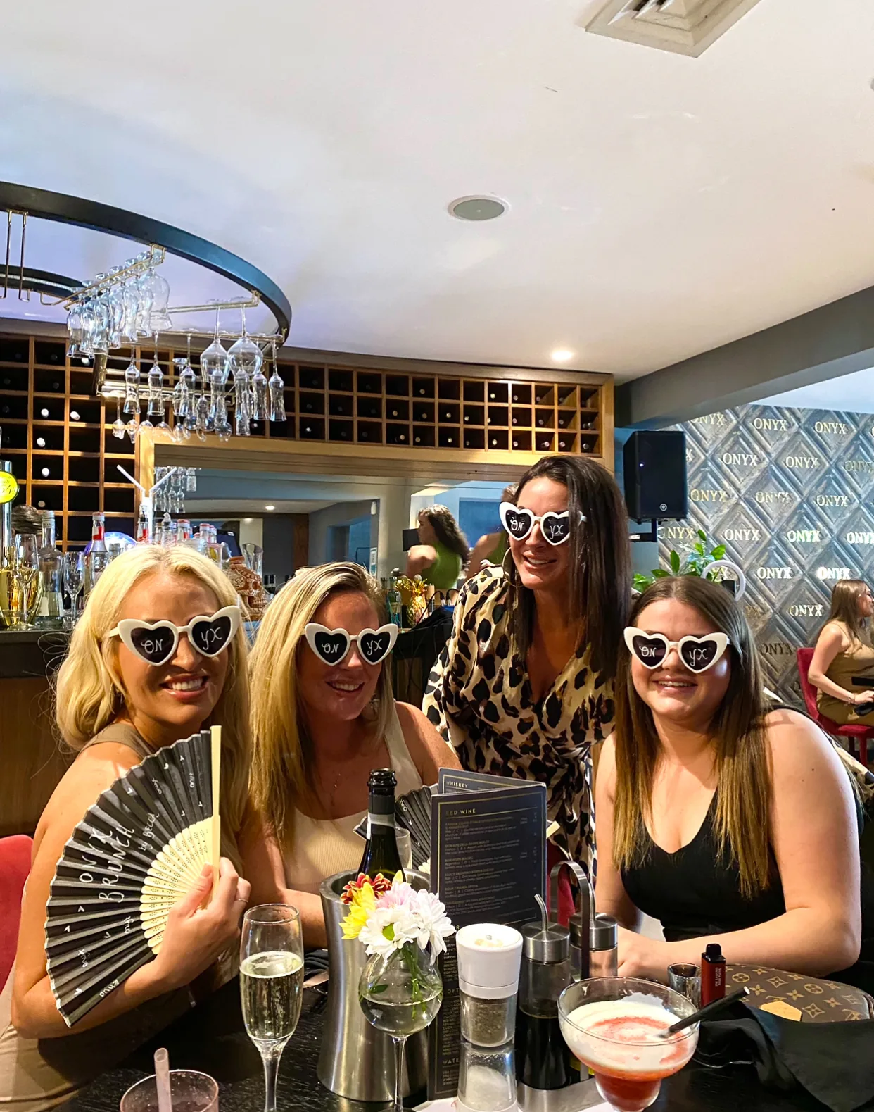 Group celebration at a table inside Onyx